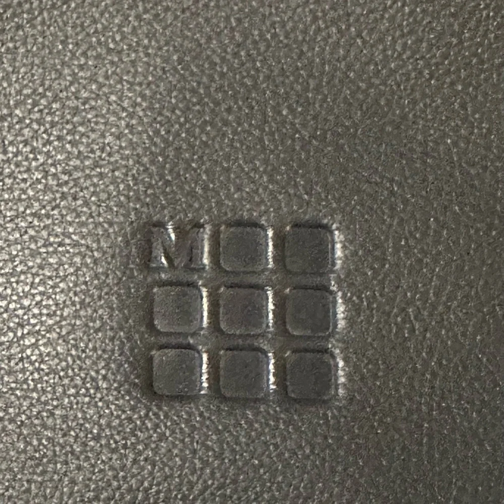 Moleskine Black Leather Laptop Bag w/ adj. waist strap.